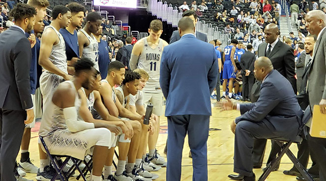 Coach Ewing talking to team during timeout vs Central Connecticut
