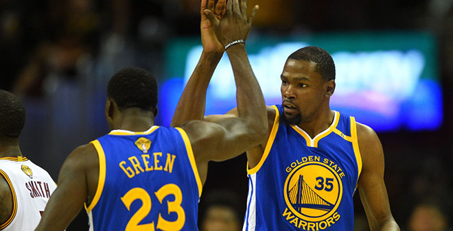 Draymond Green and Kevin Durant high fiving
