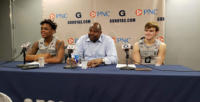 Patrick Ewing sits with Mac McClung and James Akinjo after win over UALR. Photo Credit: Marcus Washington/Making the Cut