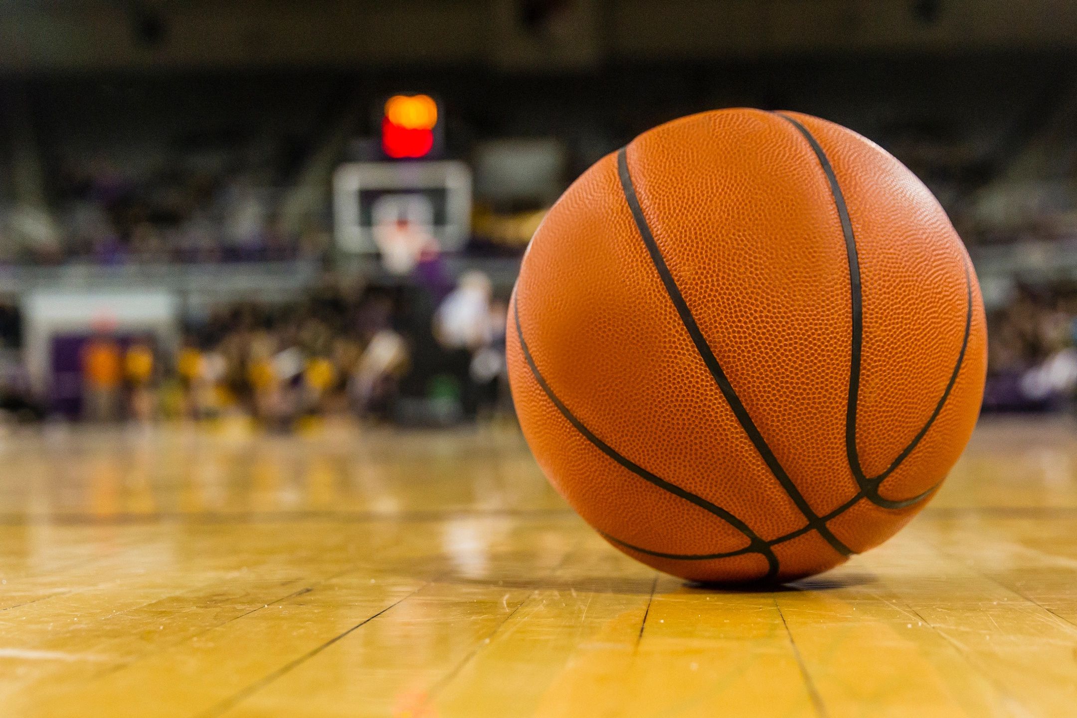 Basketball laying on the court