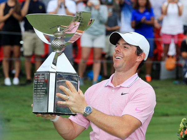 Rory McIlroy holding trophy