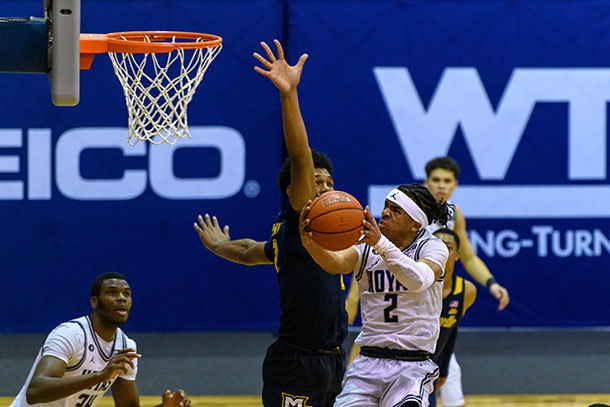 Dante Harris driving the ball to the basket against Marquette. Photo Credit: Rafael Suanes / Georgetown Athletics.