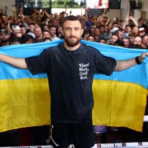 Vasily Lomachenko poses with the flag during a workout (Courtesy: Mikey Williams/Top Rank)