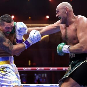 Tyson Fury hits Oleksandr Usyk with a jab in their first meeting. (Photo Courtesy: Mikey Williams/Top Rank)