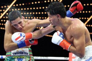 Xander Zayas lands punch against Jorge Garcia Perez (Photo Courtesy: Mikey Williams/Top Rank)
