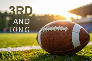 Football laying on the ground with the words 3rd and Long beside it.