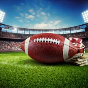 A football laying in a stadium with money laying beside it. Indicating gambling